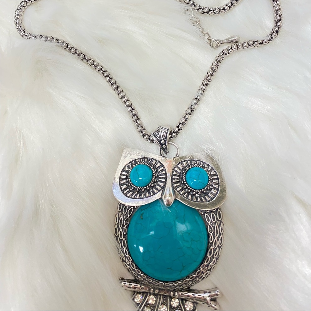 An owl pendant necklace designed with an antique concept. Old silver necklaces